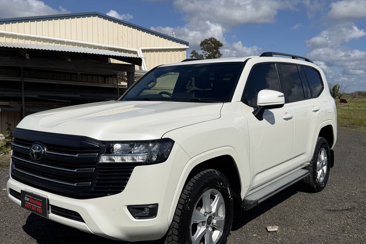 A white Toyota LandCruiser finished by Jayden Nelson, the paint holding a clean, even gloss