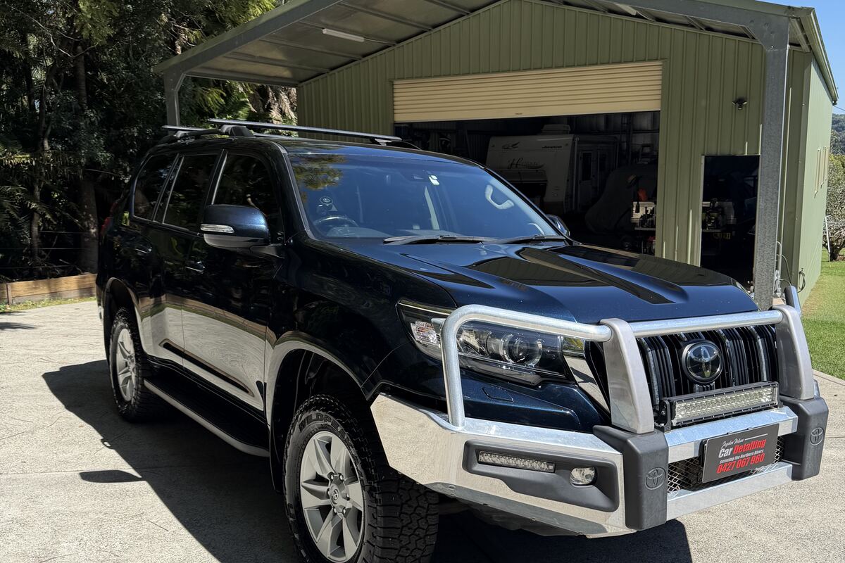 A dark Toyota Prado finished by Jayden Nelson, paint reflecting cleanly